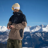 Volcom 2L Insulated GORE-TEX Jacket - A tan and black jacket with a hood, featuring two zippered pockets on the front.
