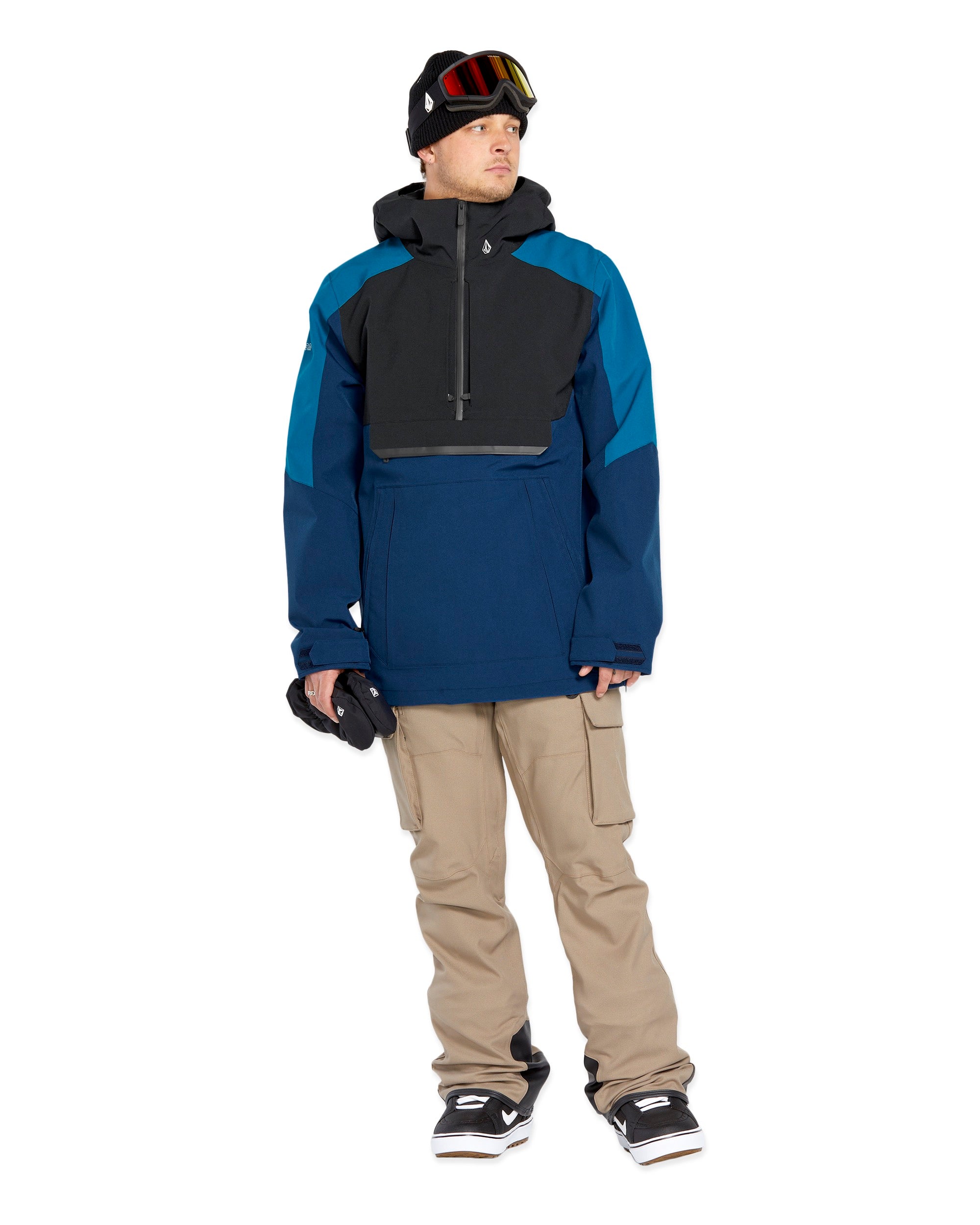 Volcom Brighton Pullover Jacket - A navy blue jacket with a black chest pocket and white logo on the left sleeve.