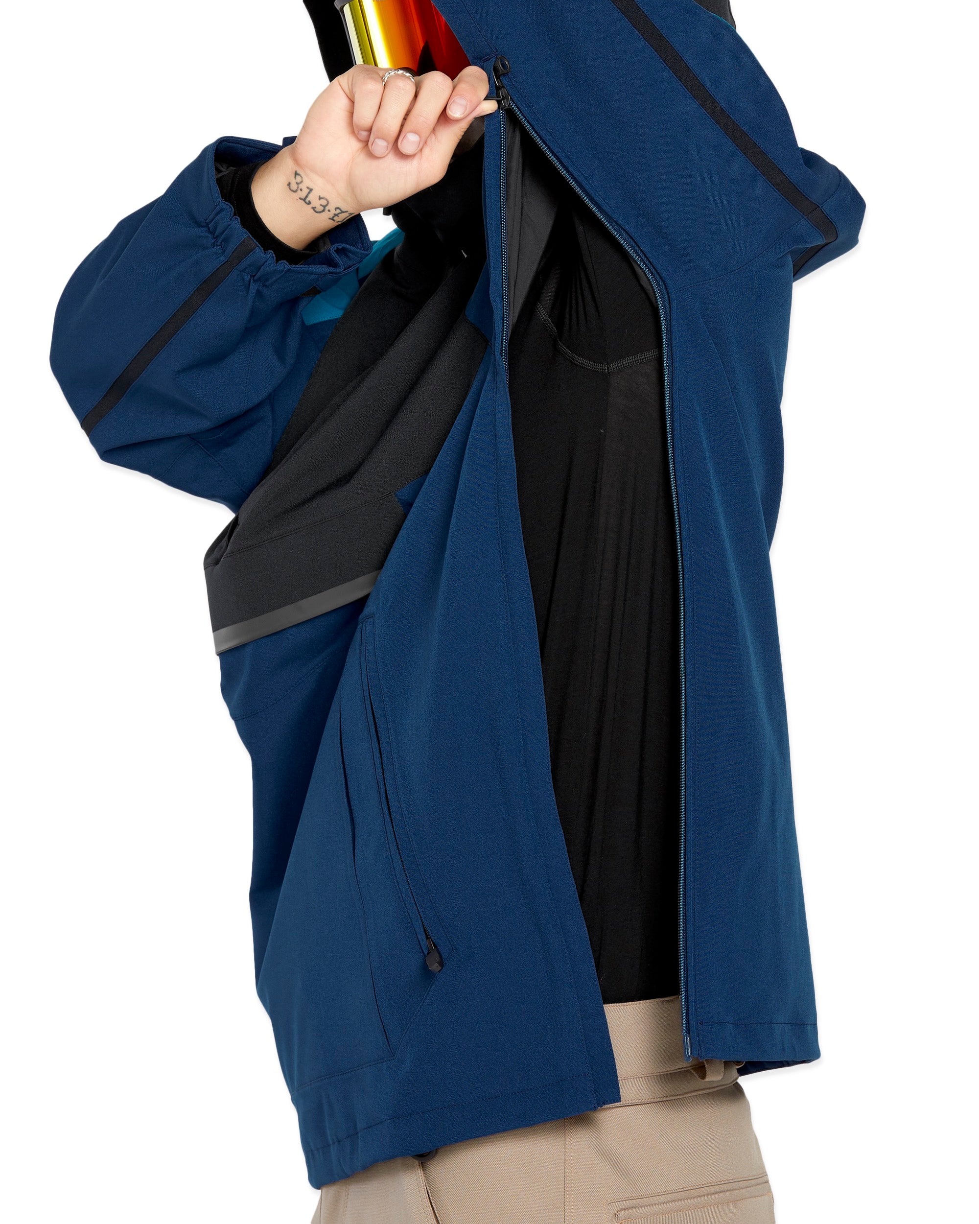 Volcom Brighton Pullover Jacket - A navy blue jacket with a hood, featuring a zipper closure and two zippered pockets on the front.