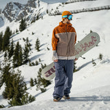 Volcom Nightbreaker 20K Jacket 2025 - A tan jacket with a white stripe across the chest and two zippered pockets on either side of the waist.