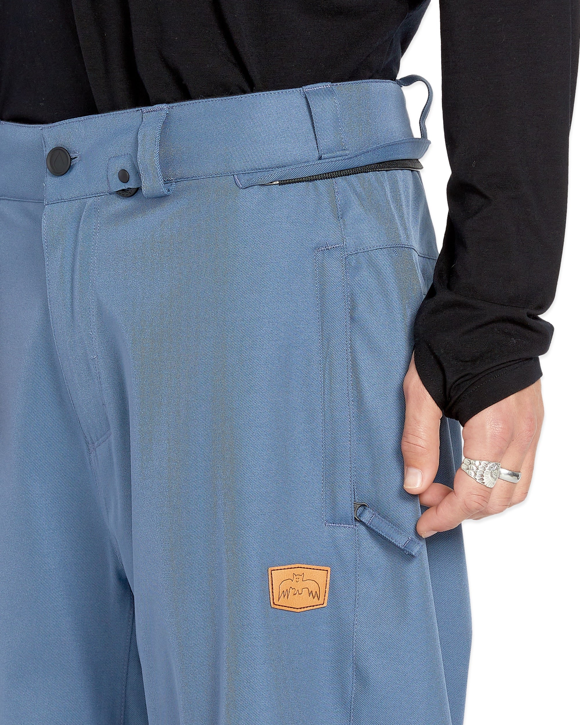 Volcom Longo 20K Pullover Jacket - A light blue jacket with a zipper and two pockets on either side, featuring a logo patch on the left chest area.