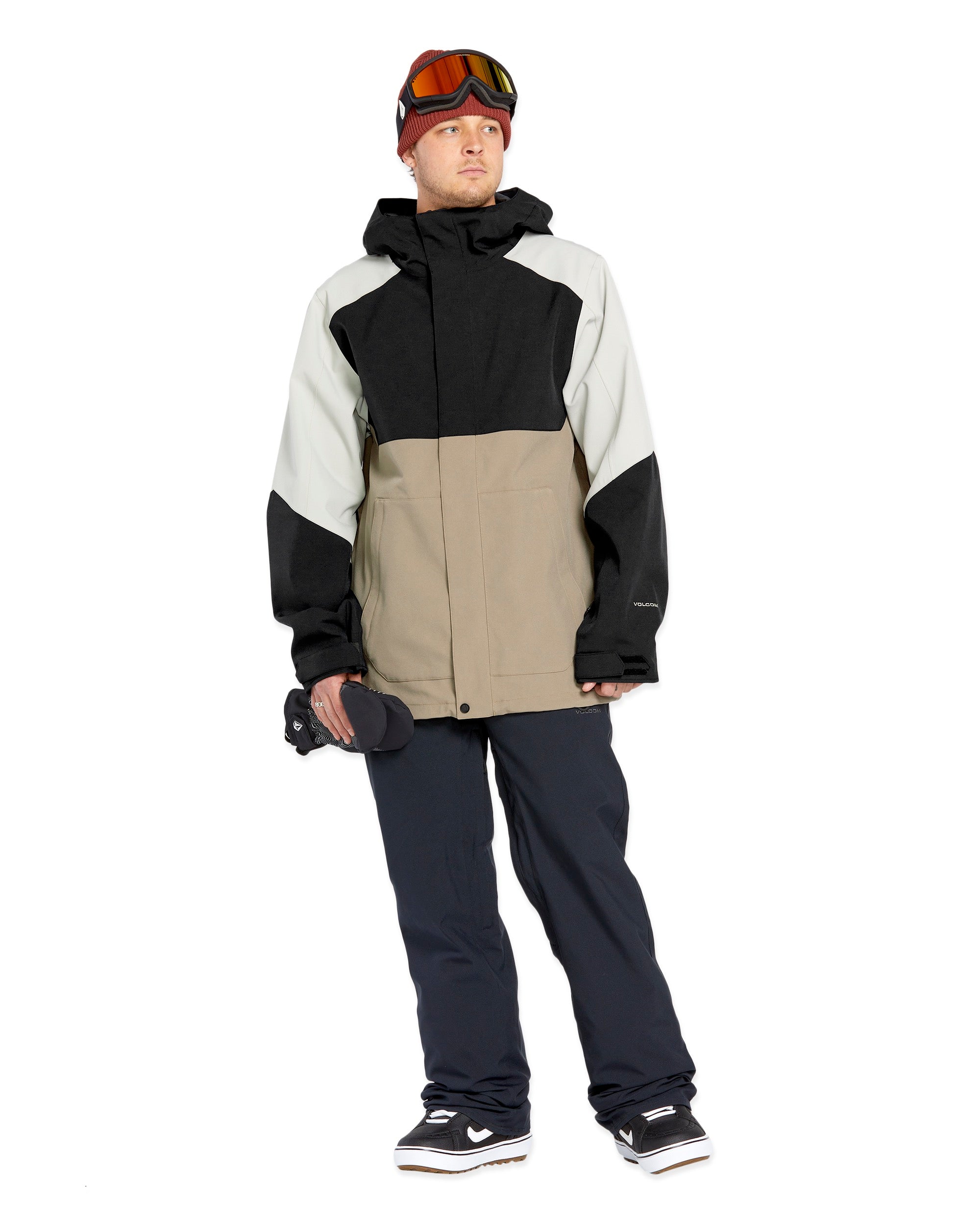 Volcom Brighton FZ Shell Jacket - A black, white, and tan jacket with a hood, featuring a zippered front and two side pockets.