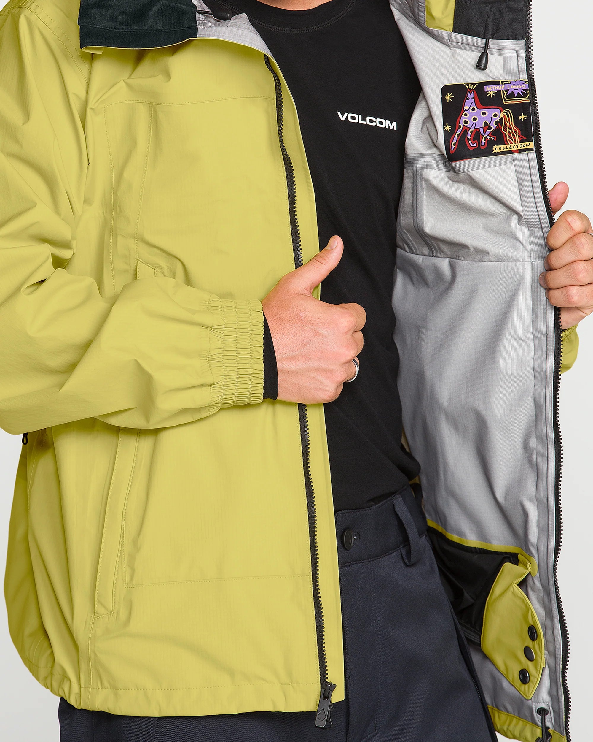 Yellow 3L 20K ski jacket interior with Volcom logo patch and zip opening