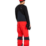 Volcom Men's Rain GORE-TEX Bib Overall - A pair of red and black bib overalls with a rain jacket attached, featuring adjustable straps and pockets on the front.