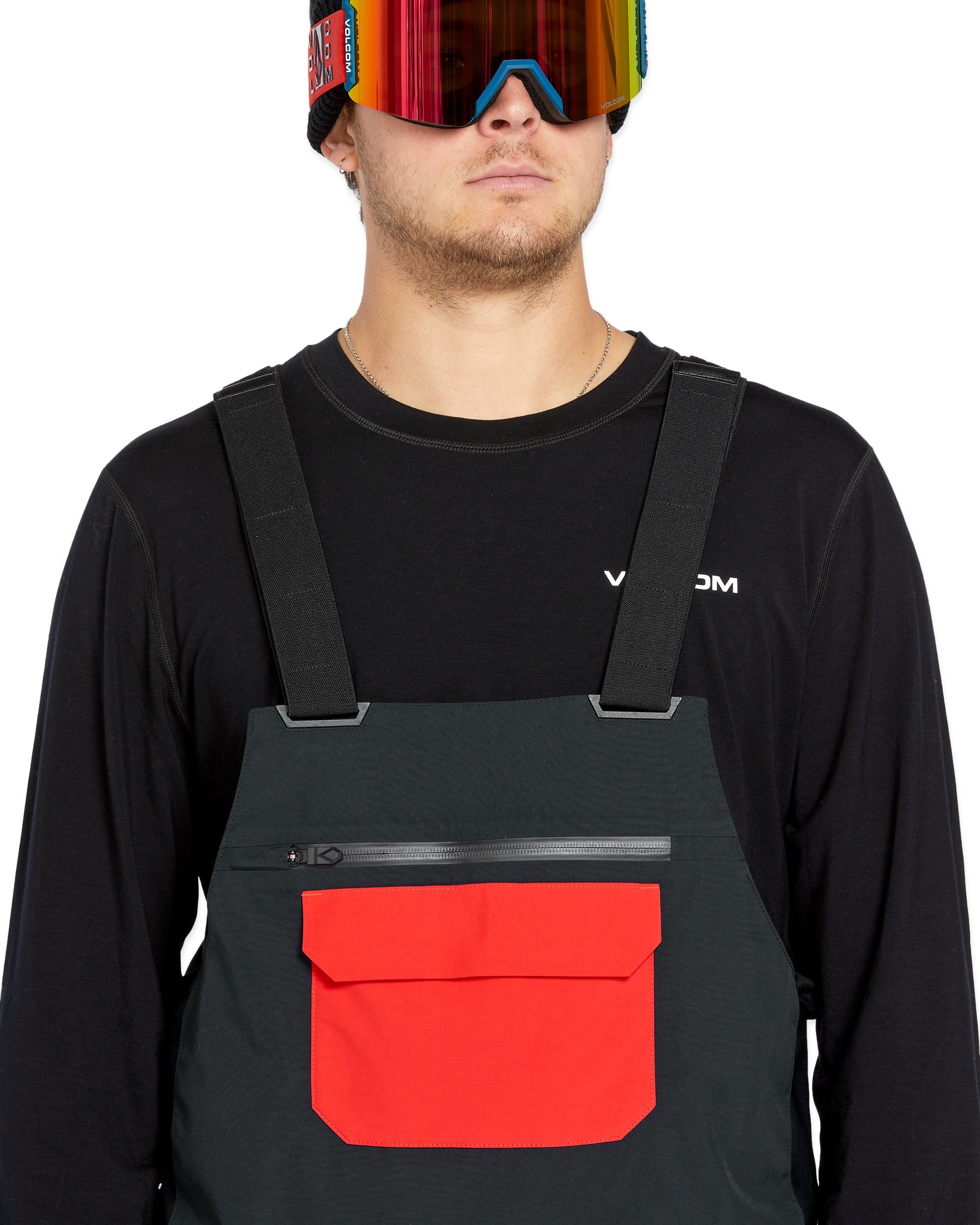 Volcom Men's Rain GORE-TEX Bib Overall - A pair of black waterproof overalls with a red pocket on the front.
