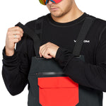 Volcom Men's Rain GORE-TEX Bib Overall - Black bib overalls with a large red logo on the left thigh and black straps.