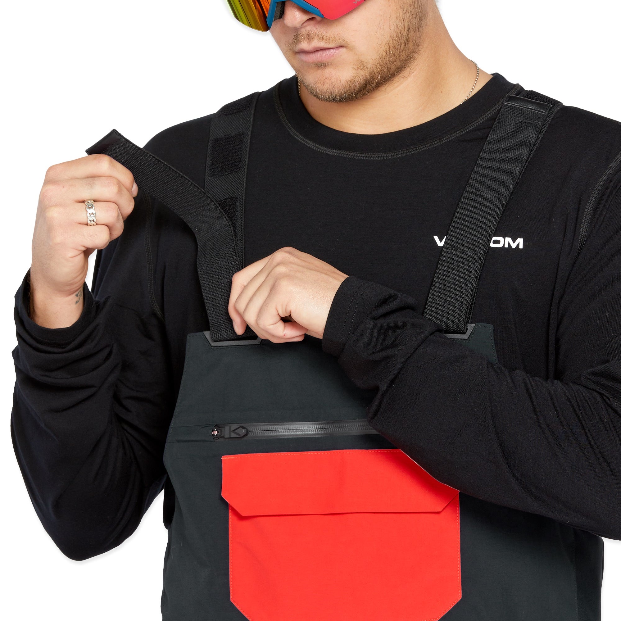 Volcom Men's Rain GORE-TEX Bib Overall - Black bib overalls with a large red logo on the left thigh and black straps.