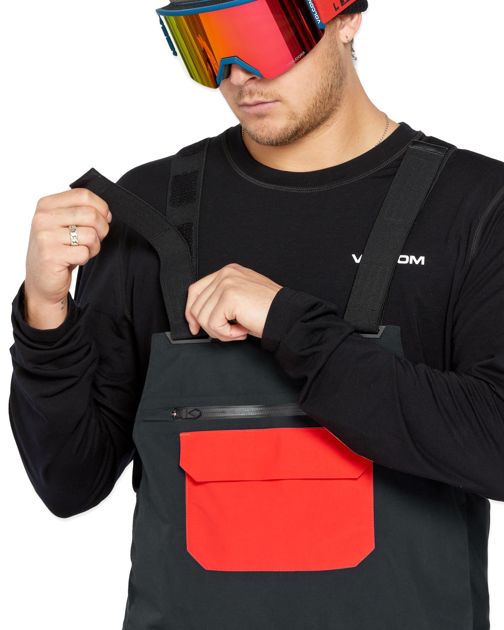 Volcom Men's Rain GORE-TEX Bib Overall - Black bib overalls with a large red logo on the left thigh and black straps.