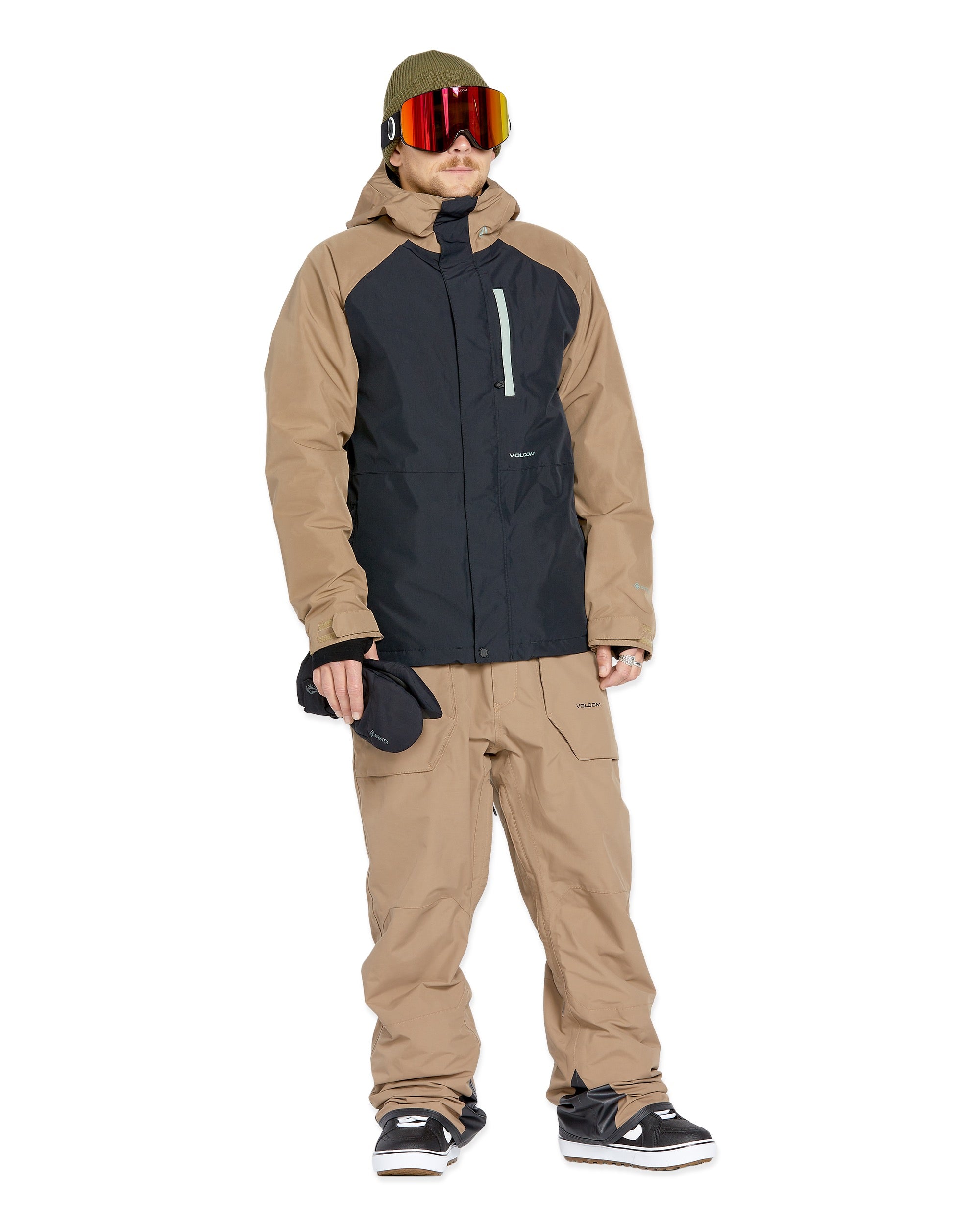Volcom Men's Rain GORE-TEX Bib Overall - A black bib overall with a tan rain jacket and matching pants, featuring a hood on the jacket.