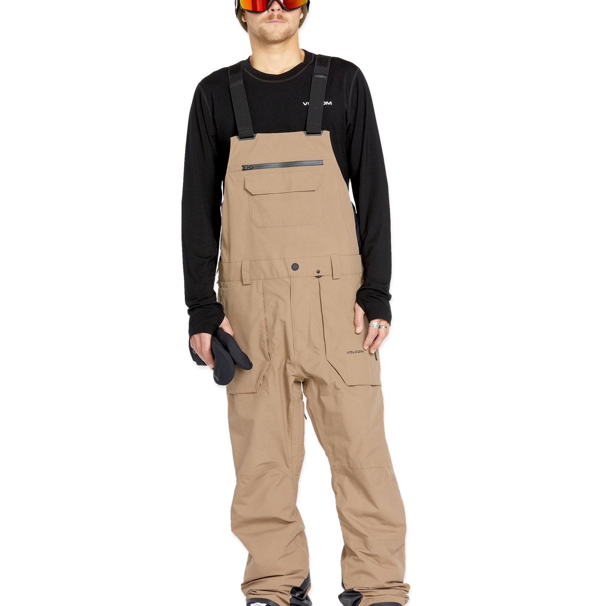 Volcom Men's Rain GORE-TEX Bib Overall - A pair of khaki-colored bib overalls with a zippered fly and two front pockets.