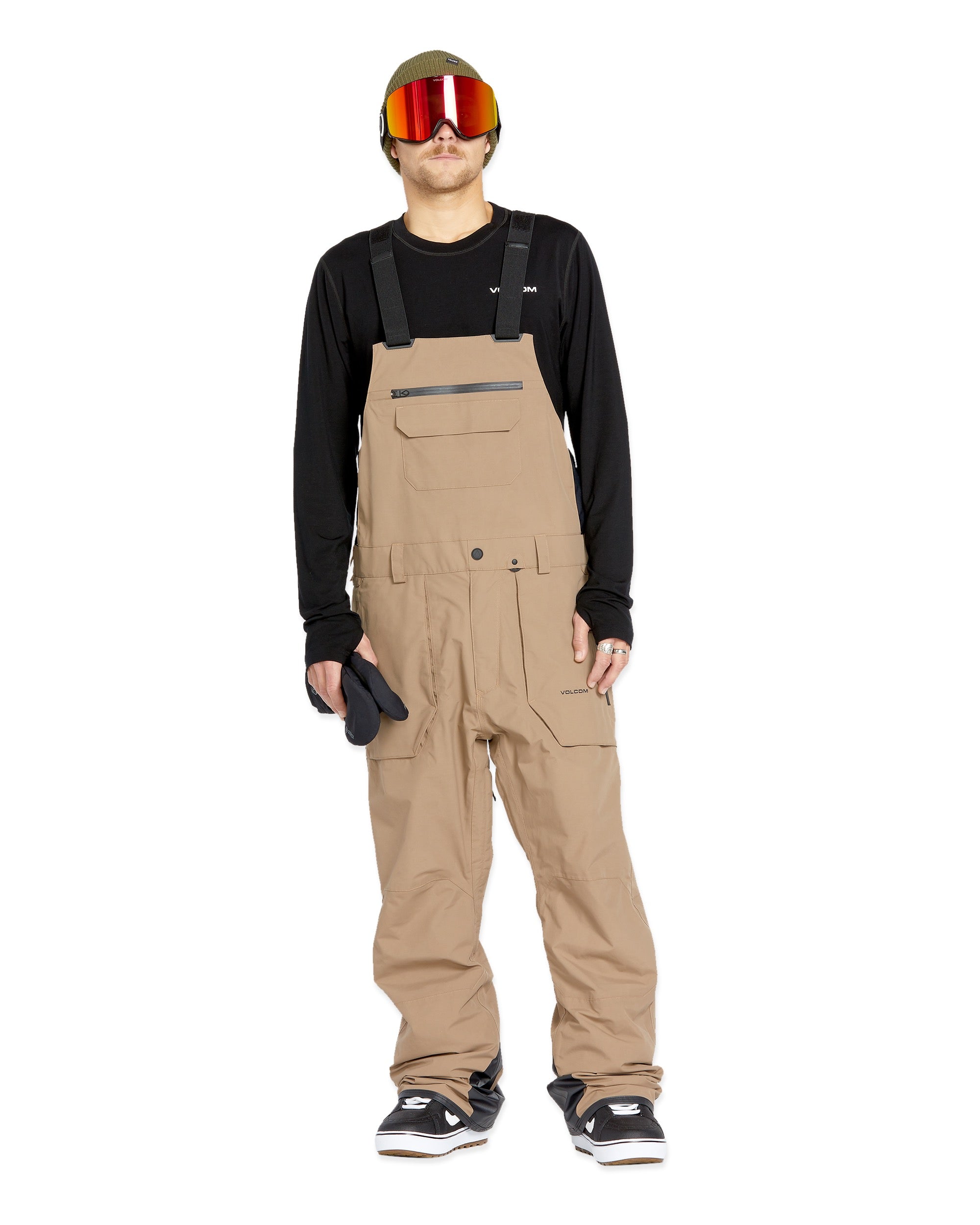 Volcom Men's Rain GORE-TEX Bib Overall - A pair of khaki-colored bib overalls with a zippered fly and two front pockets.