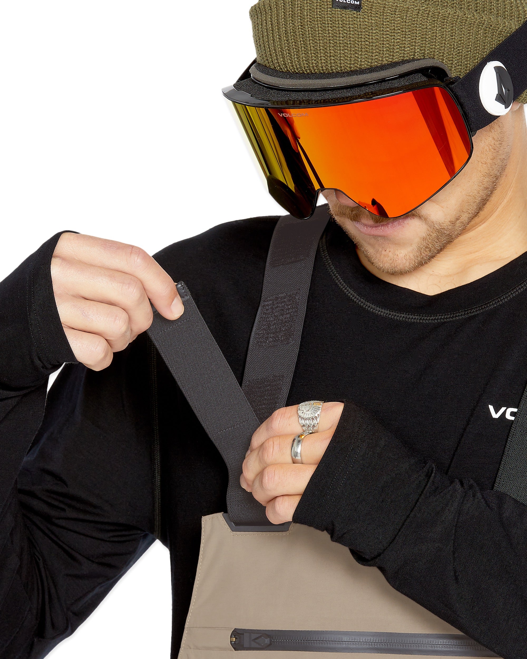 Volcom Men's Rain GORE-TEX Bib Overall - A pair of khaki-colored bib overalls with a black zipper and adjustable straps.