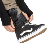 Volcom Men's Rain GORE-TEX Bib Overall - A pair of black rain pants with a white logo on the left leg, featuring a zipper fly and adjustable cuffs.