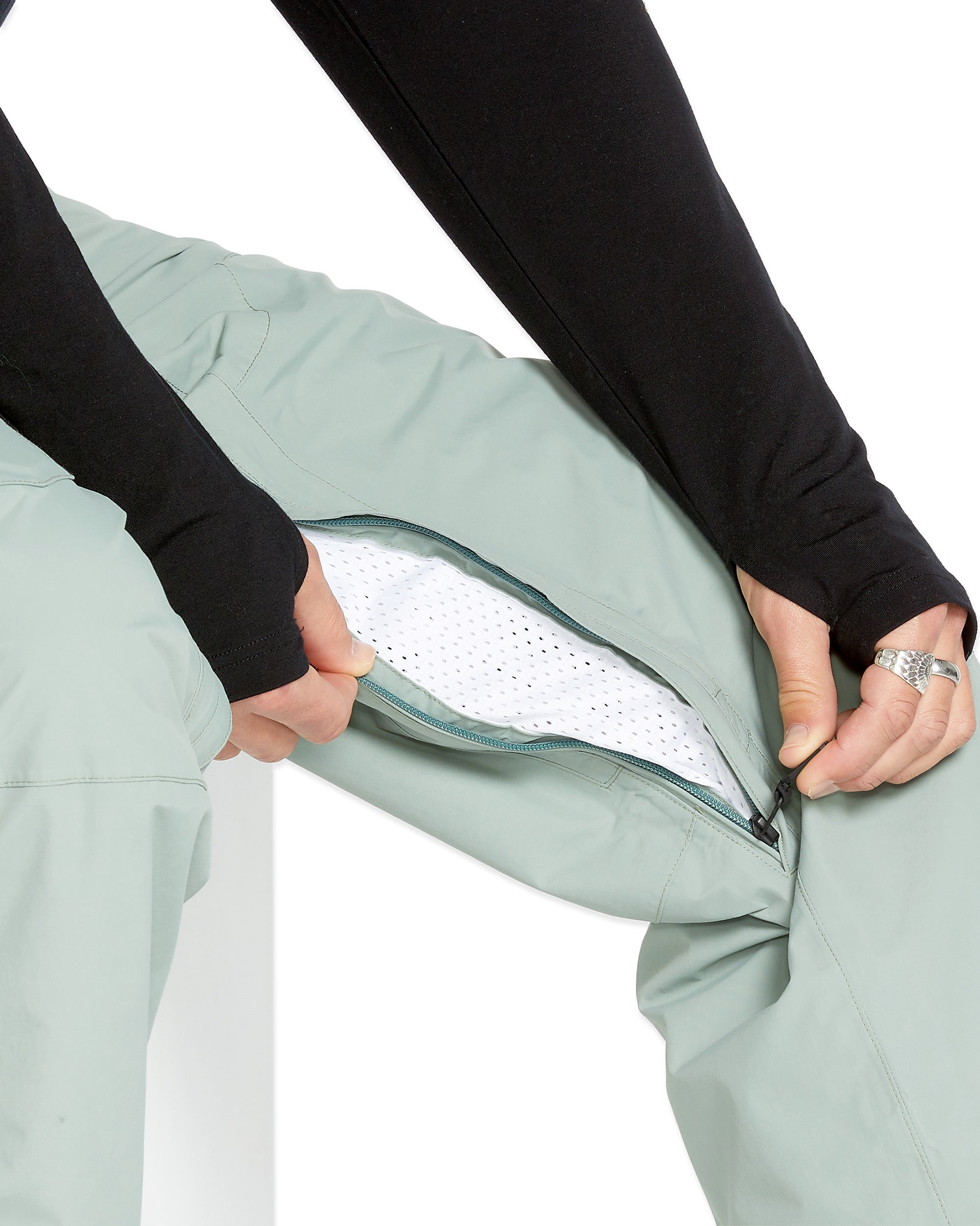 Volcom Men's L GORE-TEX Shell Pant - A pair of light green snow pants with a zippered fly and two front pockets.