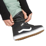 Volcom Men's L GORE-TEX Shell Pant - A pair of black pants with a white logo on the left leg, featuring a zippered fly and adjustable cuffs.