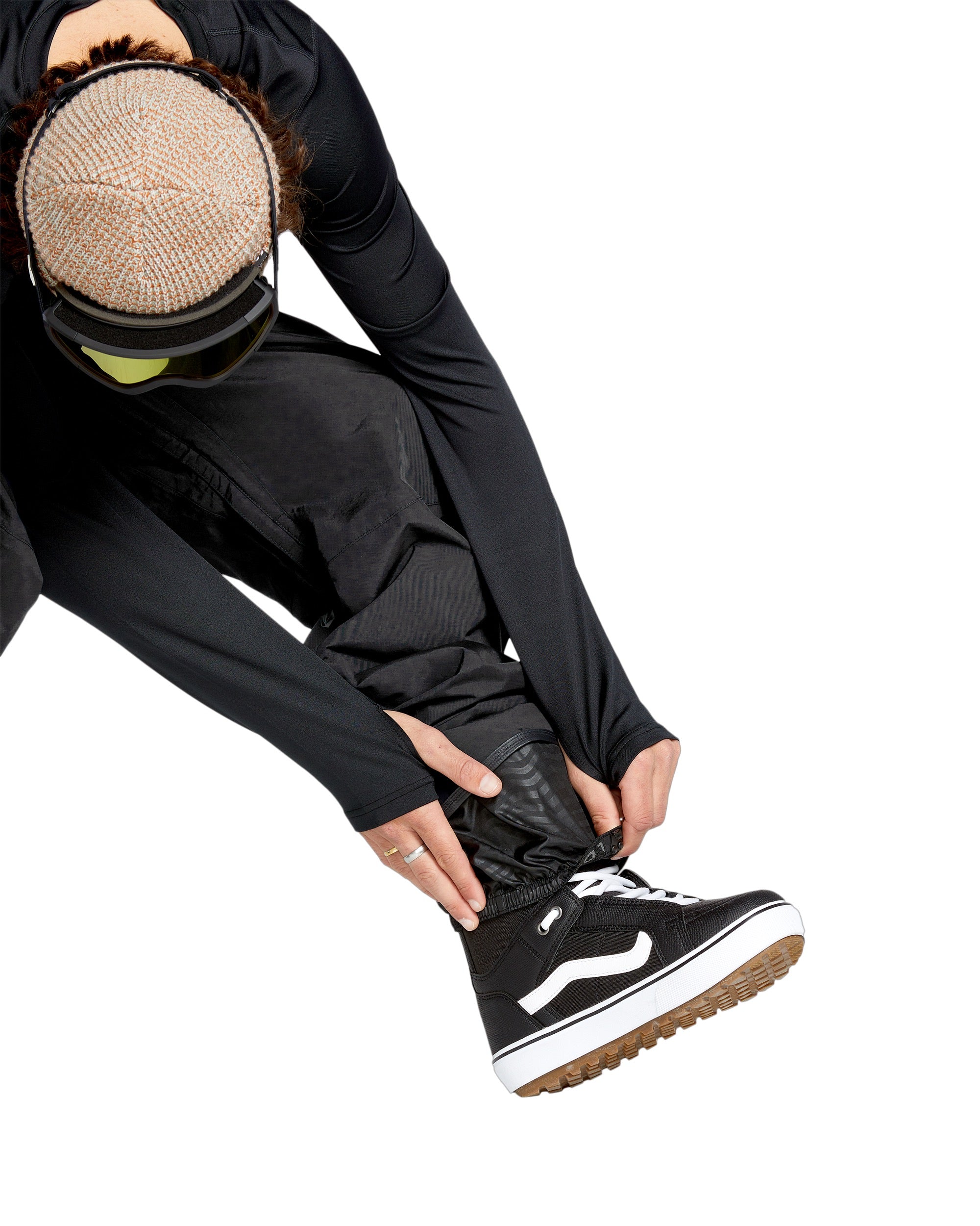 Volcom Men's L GORE-TEX Shell Pant - A pair of black snow pants with a textured pattern on the side and a zippered pocket at the thigh.