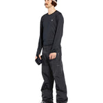 Volcom Men's L GORE-TEX Shell Pant 2025 - Black waterproof ski pants with a zippered pocket on the thigh and adjustable Velcro straps at the waist.