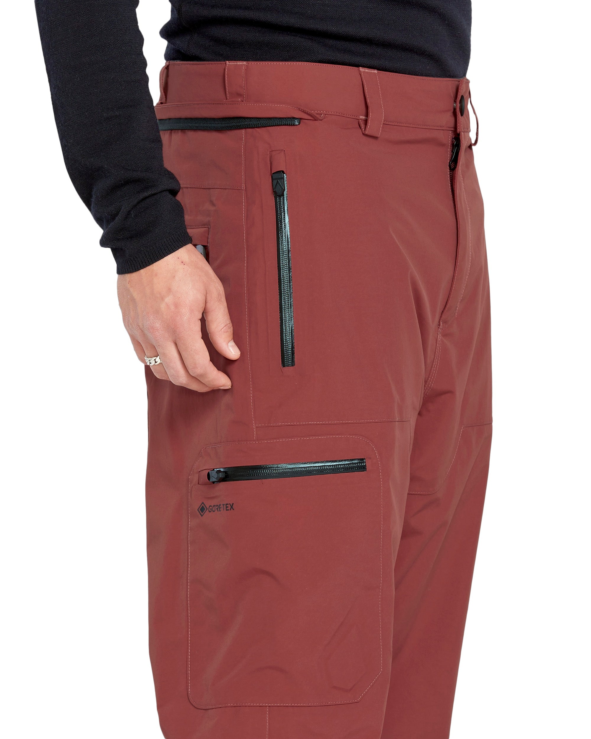 Volcom Men's L GORE-TEX Shell Pant 2025 - A pair of brown pants with a black zipper on the side pocket.