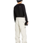 Volcom Men's L GORE-TEX Shell Pant 2025 - A black pair of snow pants with a white logo on the left thigh and a zippered pocket on the right leg.