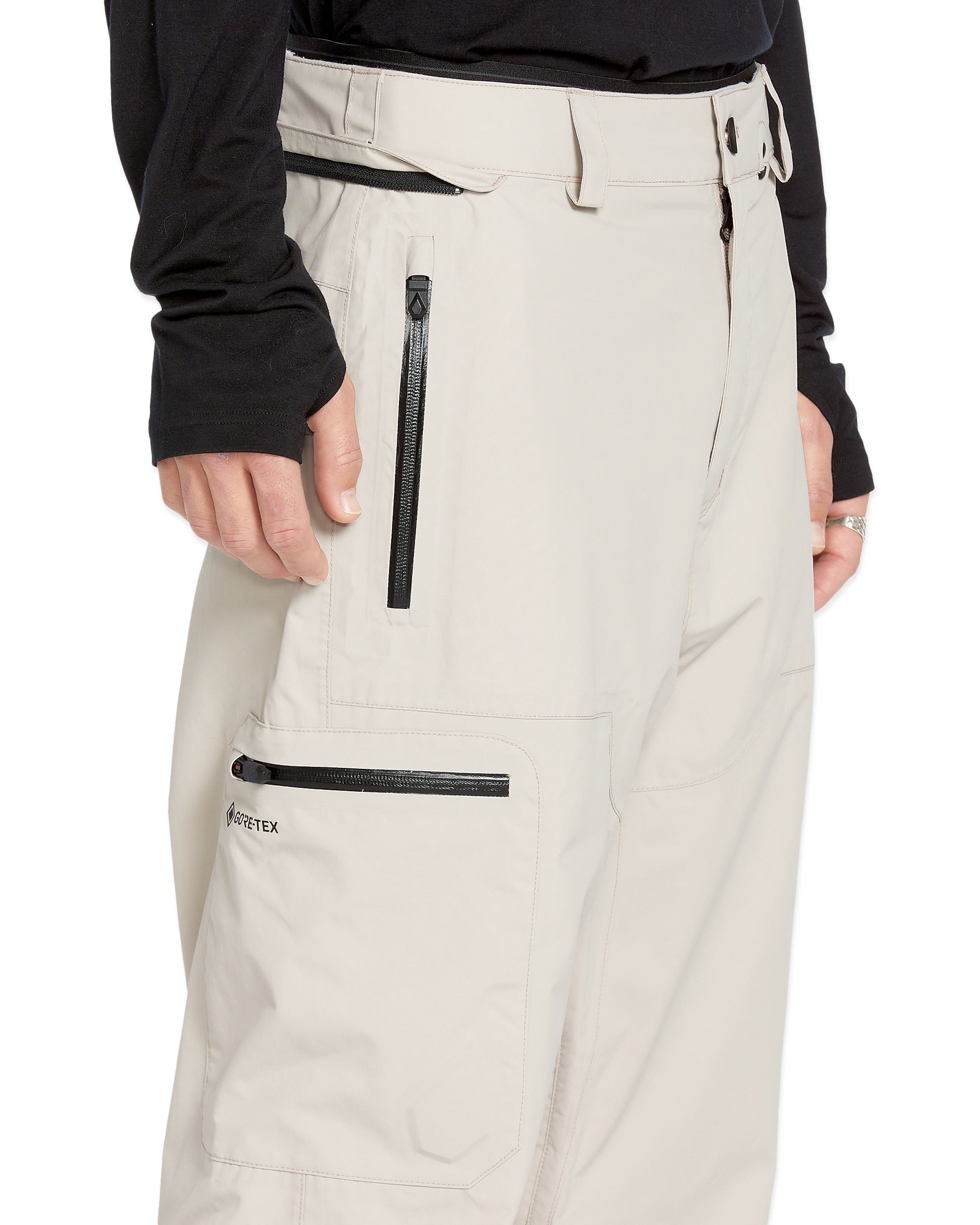 Volcom Men's L GORE-TEX Shell Pant 2025 - A pair of khaki-colored snow pants with a black zipper on the side pocket.
