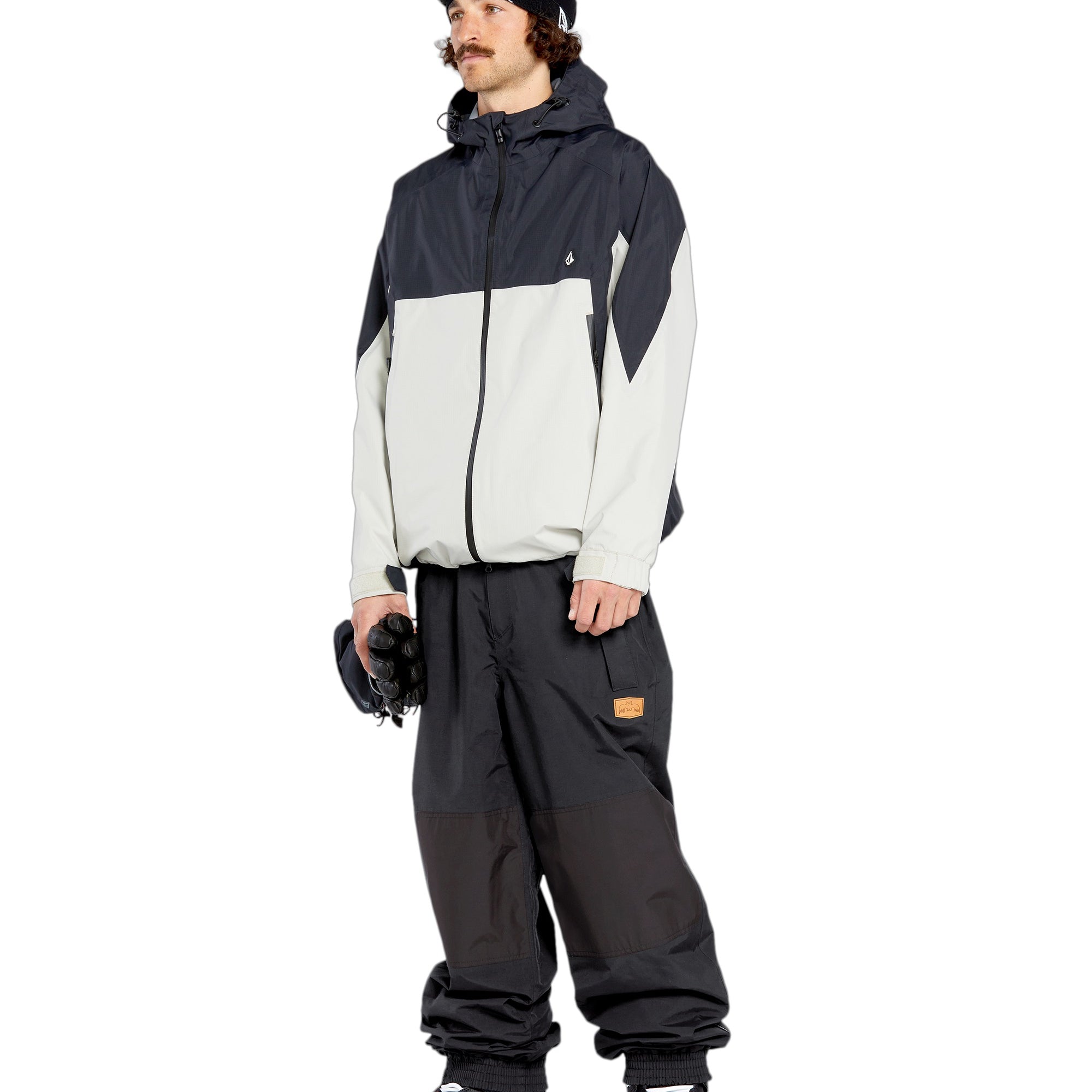 Volcom Men's Longo GORE-TEX Shell Pants - Black pants with a white logo on the left thigh and a zippered pocket on the right side.
