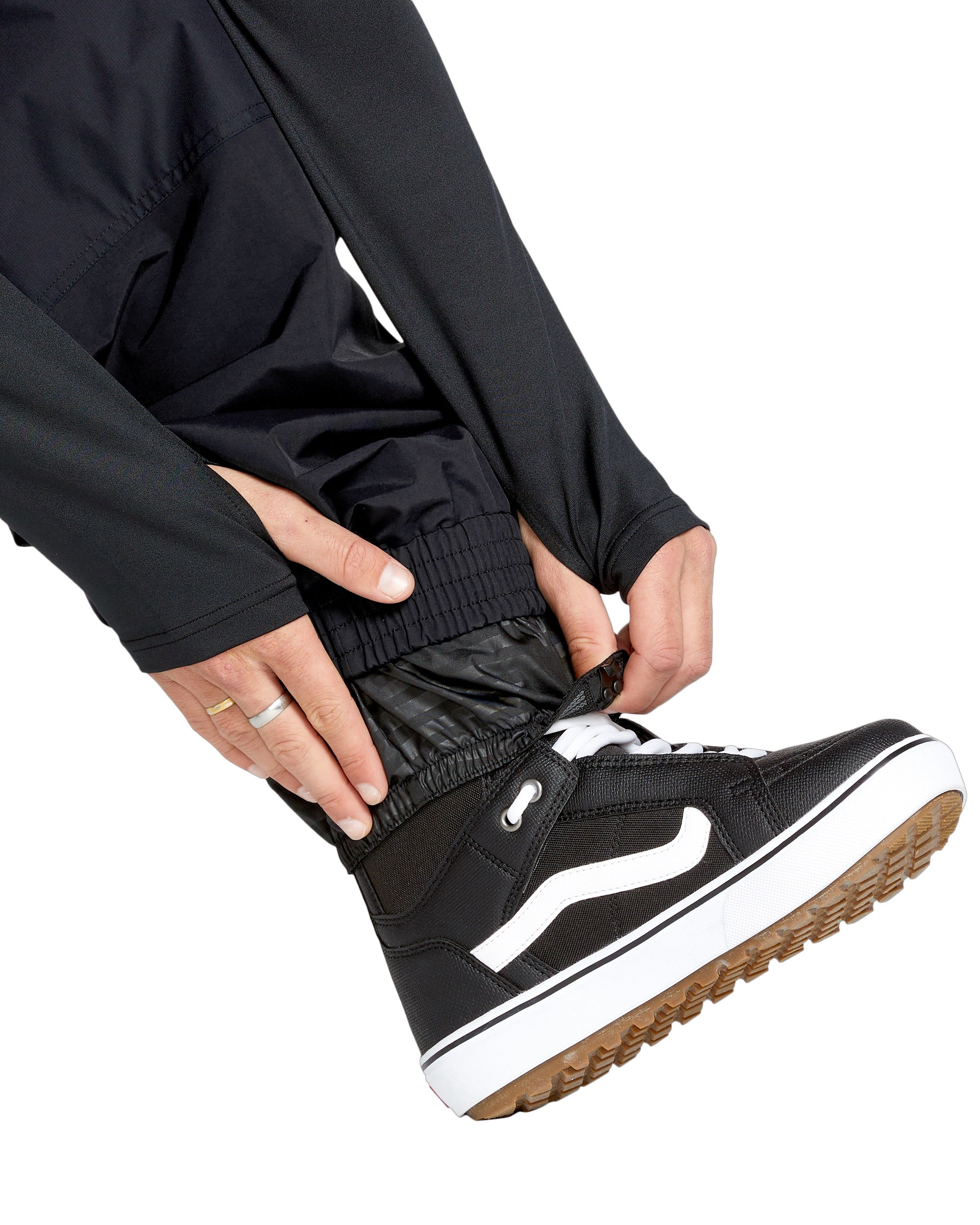 Volcom Men's Longo GORE-TEX Shell Pants - Black pants with a shiny, textured pattern on the side of the leg.