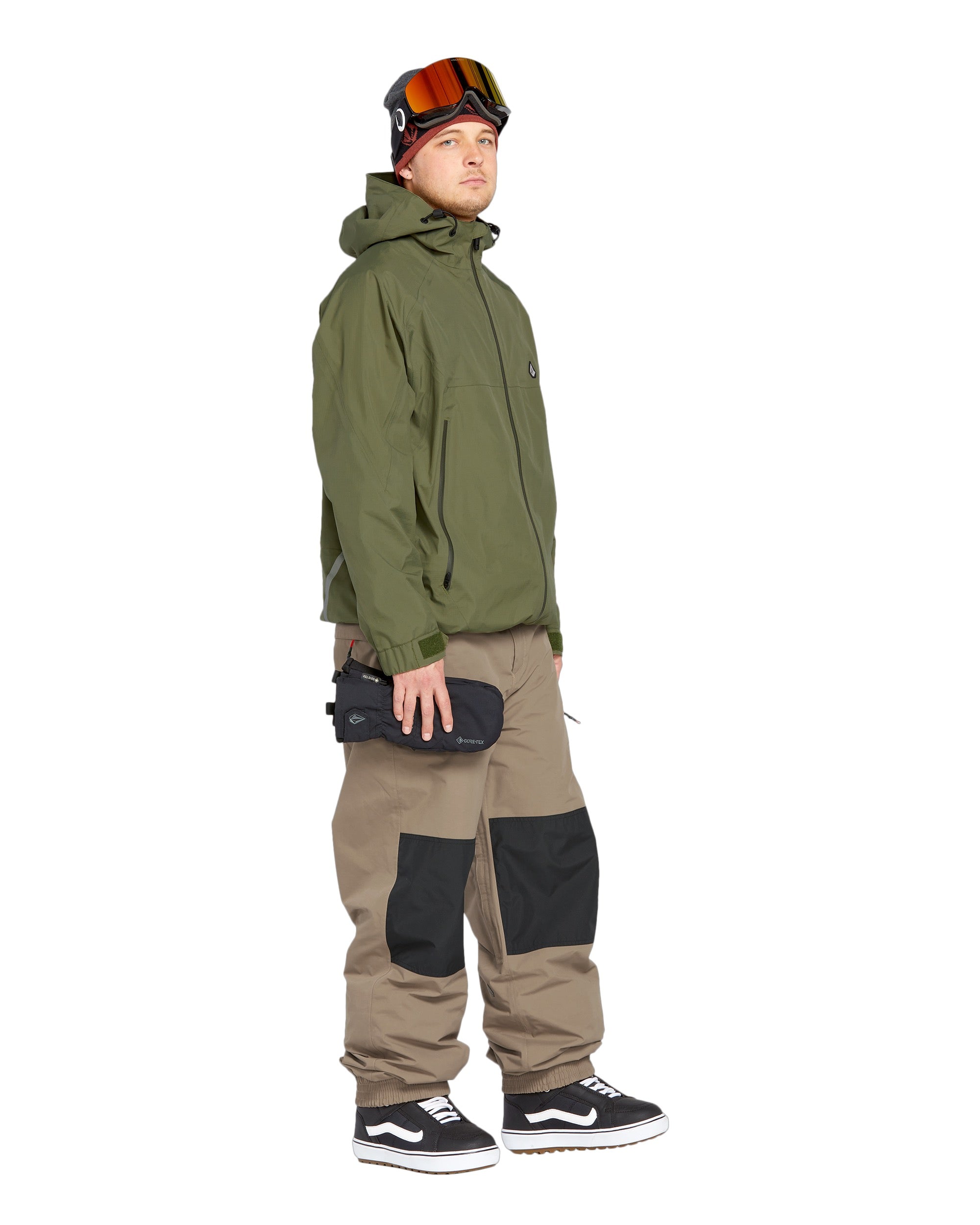Volcom Men's Longo GORE-TEX Shell Pants 2025 - A pair of olive green snow pants with a black zipper and two zippered pockets on the side.