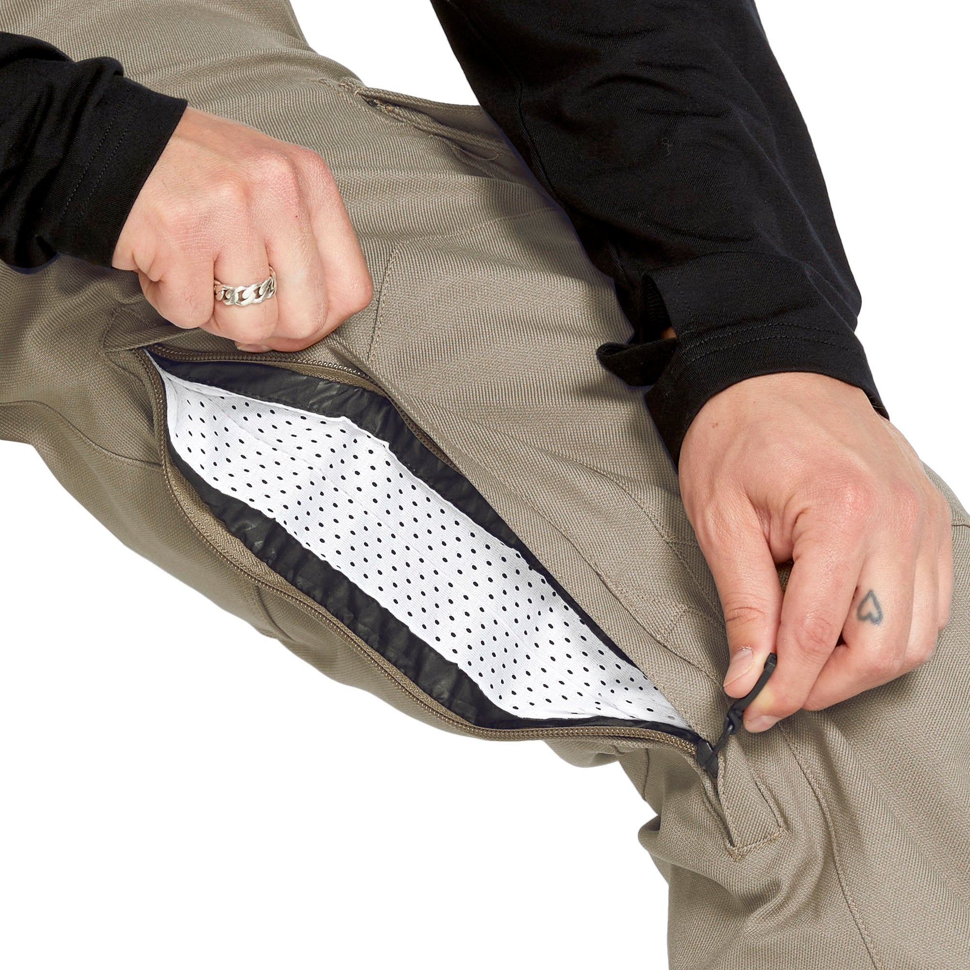 Volcom Men's New Articulated Shell Pants 2025 - Khaki pants with a black zipper and logo on the left leg.