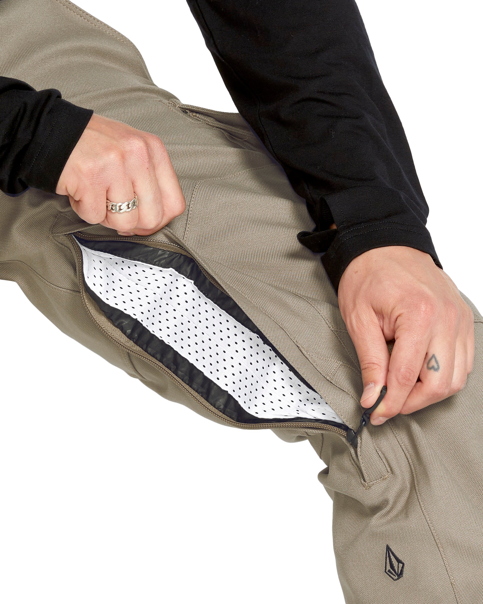 Volcom Men's New Articulated Shell Pants 2025 - Khaki pants with a black zipper and logo on the left leg.