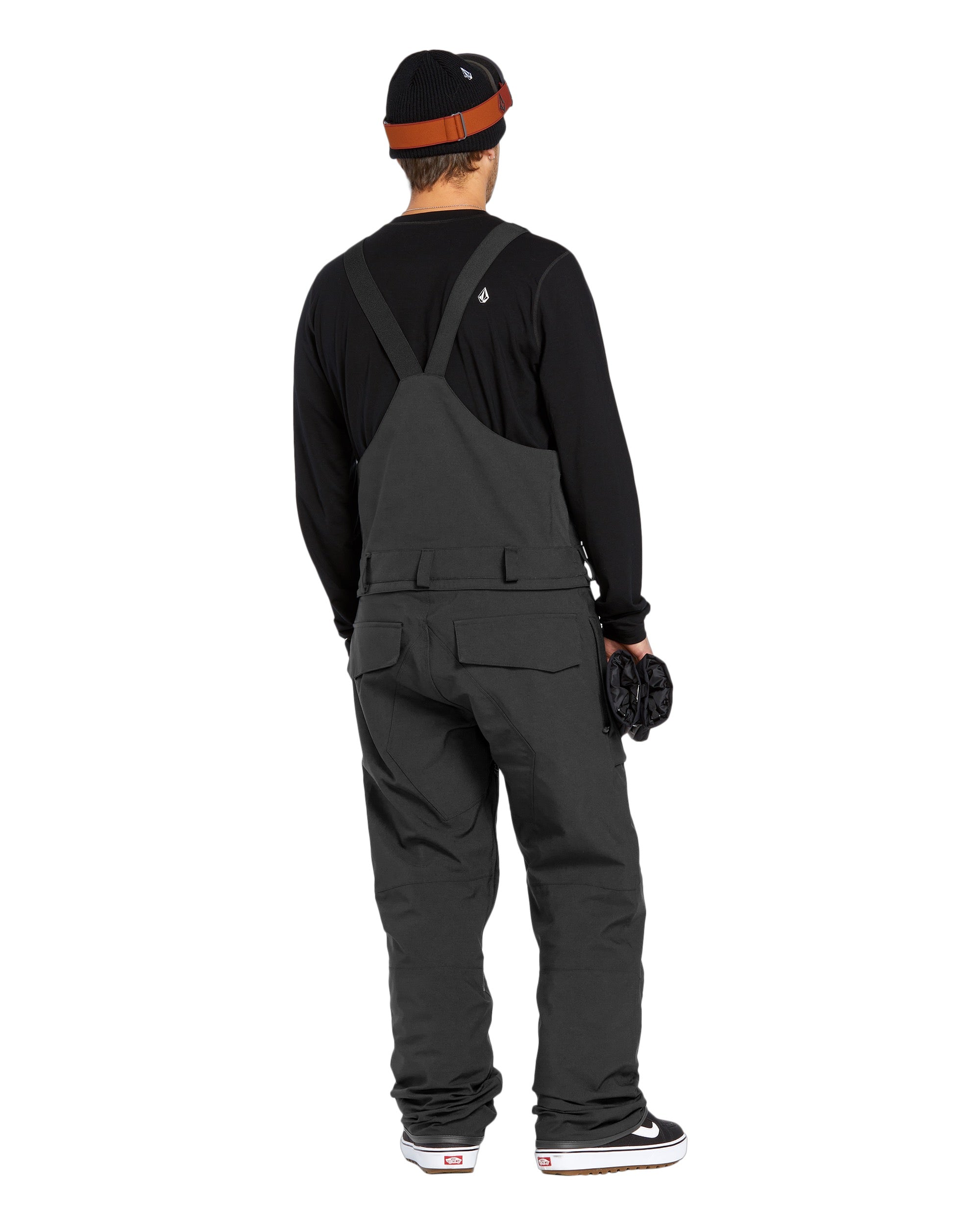 Volcom Men's Roan Shell Bib Overall - A black bib overall with a white logo on the chest and two zippered pockets on the front.