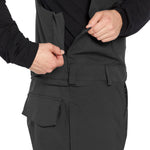 Volcom Men's Roan Shell Bib Overall - A black bib overall with a zippered front and two chest pockets, featuring a small logo on the left breast pocket.