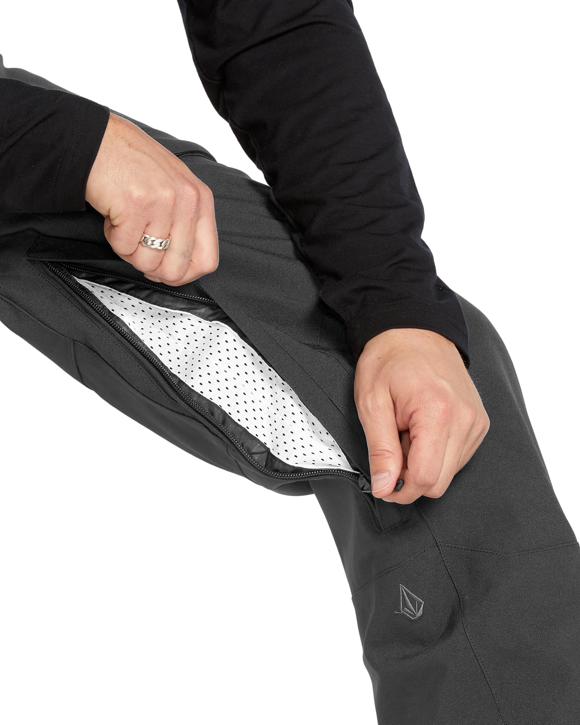 Volcom Men's Roan Shell Bib Overall - A black bib overall with a zippered fly and adjustable shoulder straps.