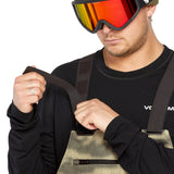 Volcom Men's Roan Shell Bib Overall - A pair of khaki-colored snow pants with a zippered fly and adjustable straps.