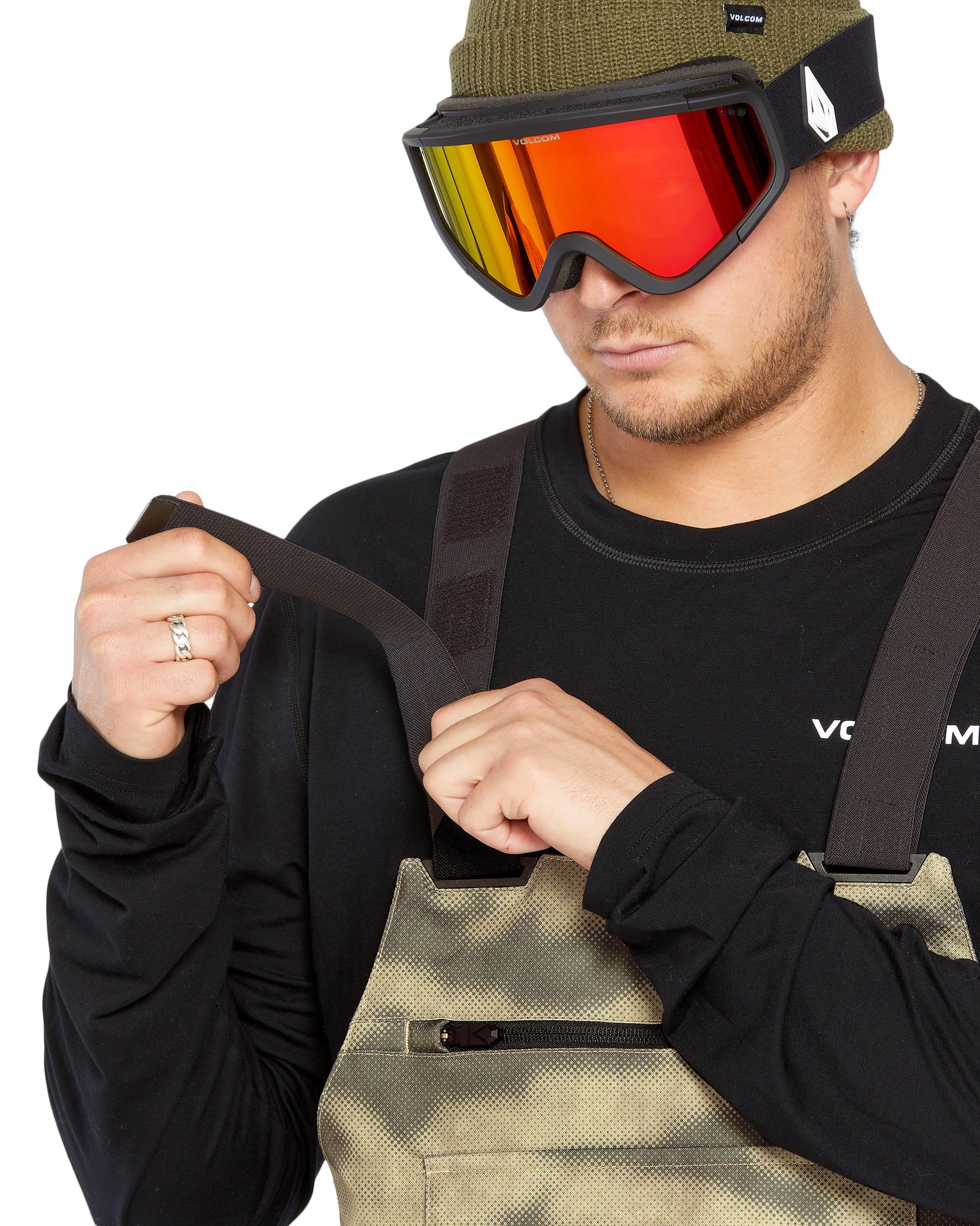Volcom Men's Roan Shell Bib Overall - A pair of khaki-colored snow pants with a zippered fly and adjustable straps.