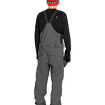 Volcom Men's Roan Shell Bib Overall - A dark gray overall with a black zipper and two front pockets, featuring a white logo on the left chest area.
