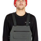 Volcom Men's Roan Shell Bib Overall - A dark gray bib overall with a zippered fly and adjustable straps.