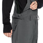 Volcom Men's Roan Shell Bib Overall - A black bib overall with a zippered front and adjustable straps.