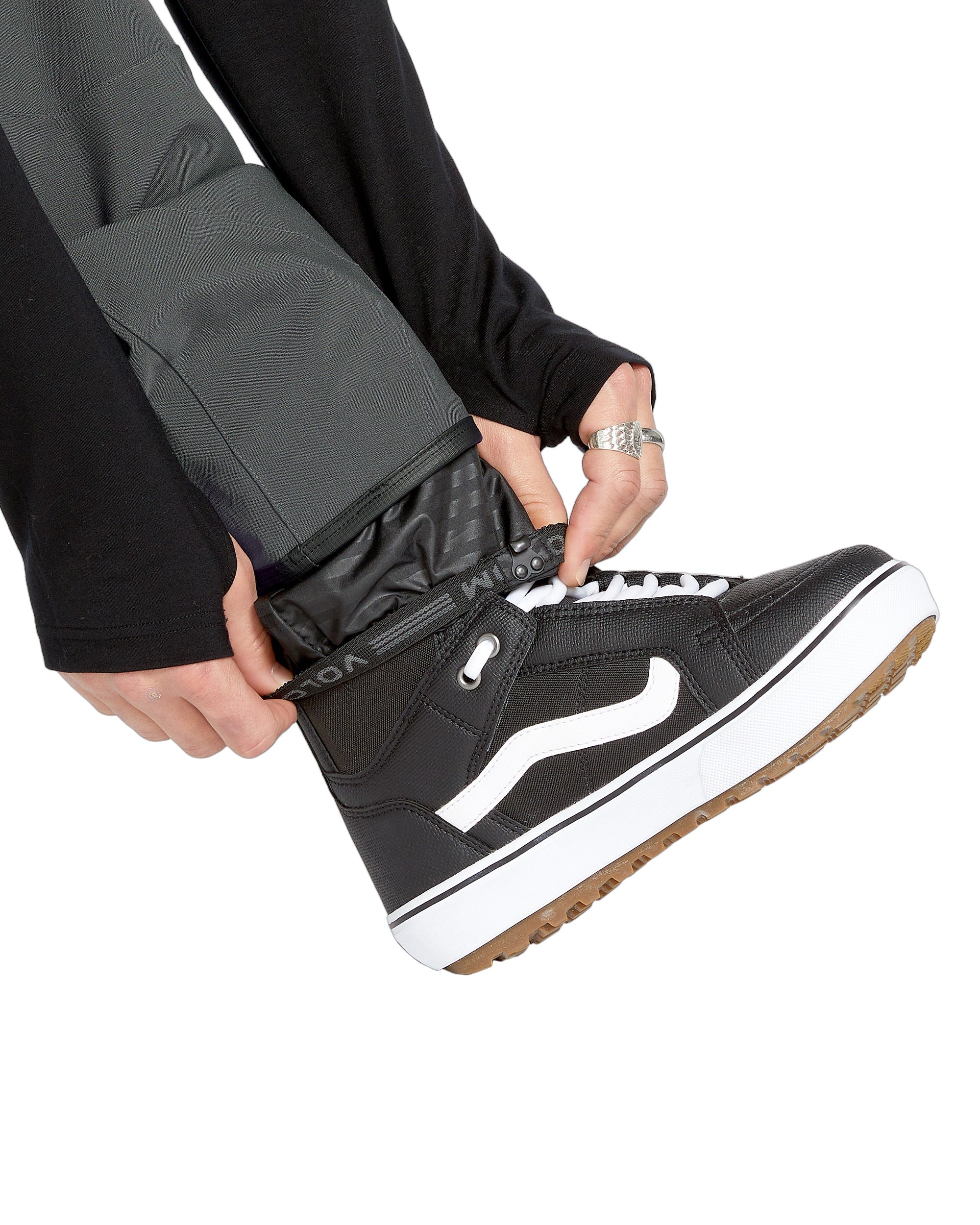 Volcom Men's Roan Shell Bib Overall - A pair of black snow pants with a white logo on the left leg.