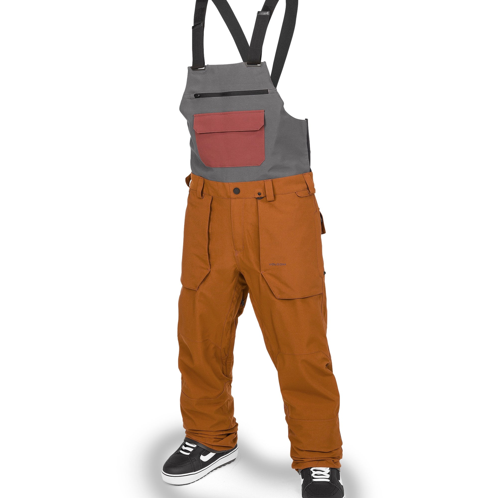 Volcom Men's Roan Shell Bib Overall - A pair of brown bib overalls with a zippered fly and two front pockets.