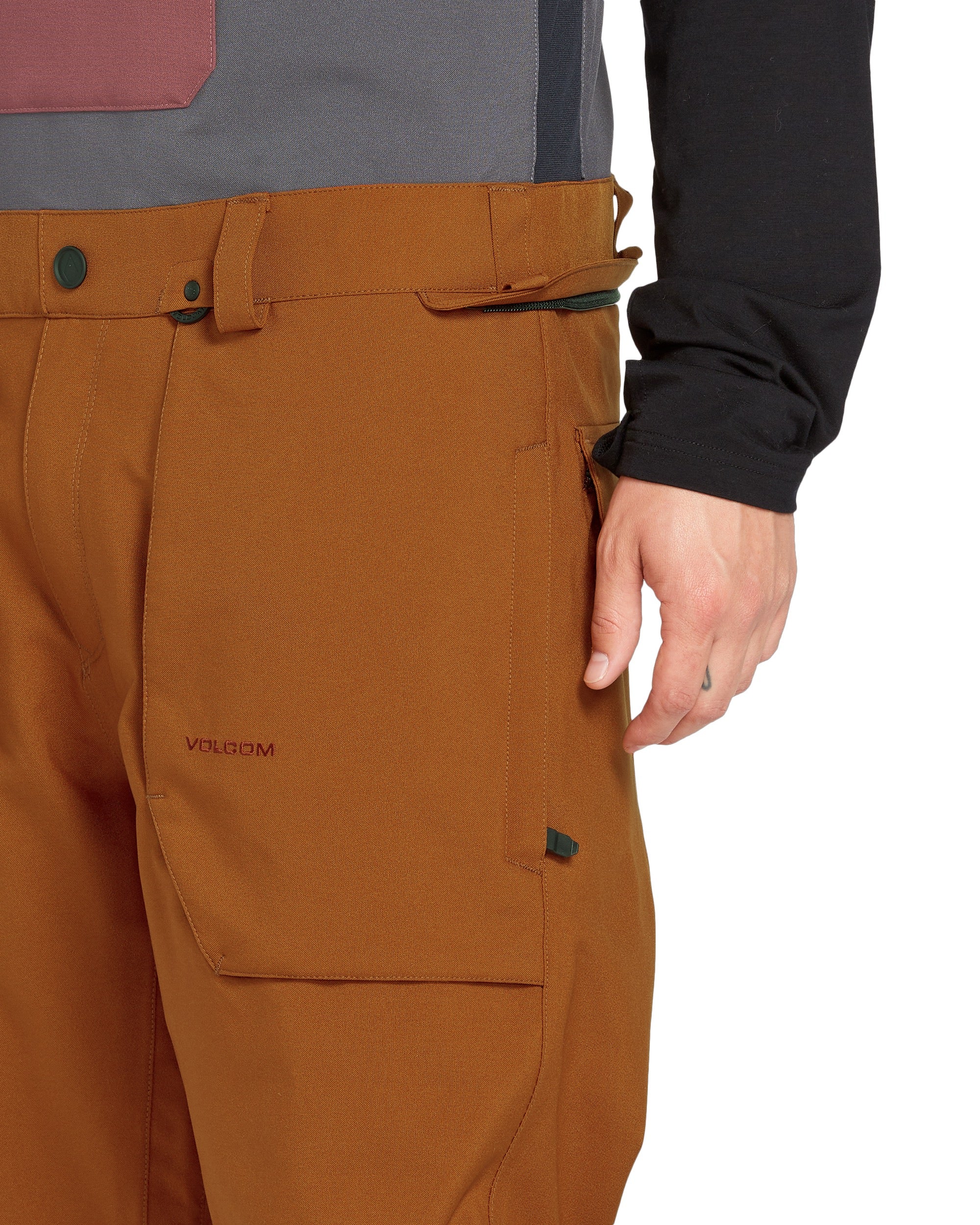 Volcom Men's Roan Shell Bib Overall - A pair of brown bib overalls with a zippered fly and belt loops.