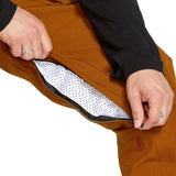 Volcom Men's Roan Shell Bib Overall - A brown bib overall with a zippered fly and adjustable shoulder straps.