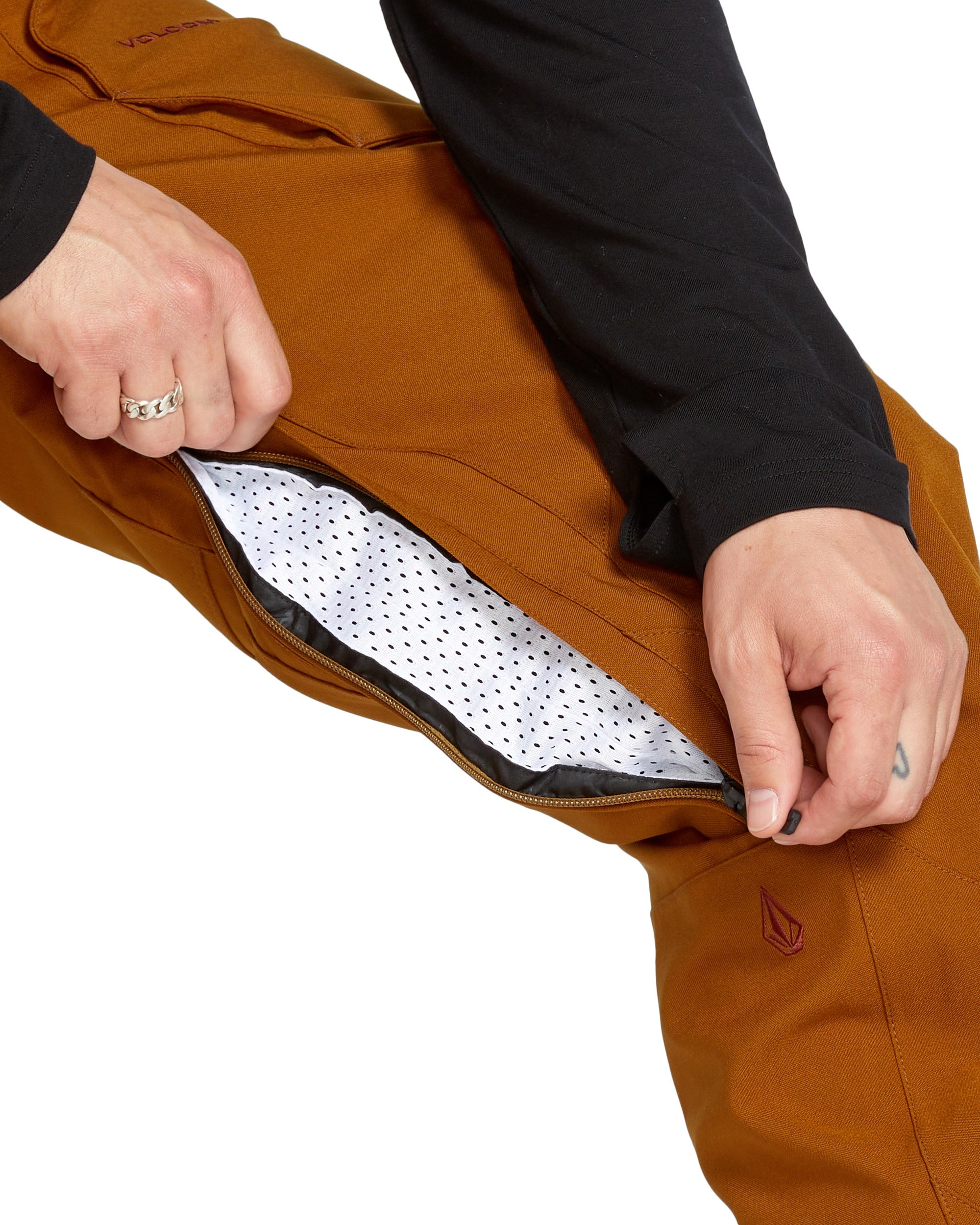 Volcom Men's Roan Shell Bib Overall - A brown bib overall with a zippered fly and adjustable shoulder straps.