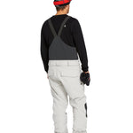 Volcom Men's Roan Shell Bib Overall - A black bib overall with a white logo on the left chest and a red zipper pull.