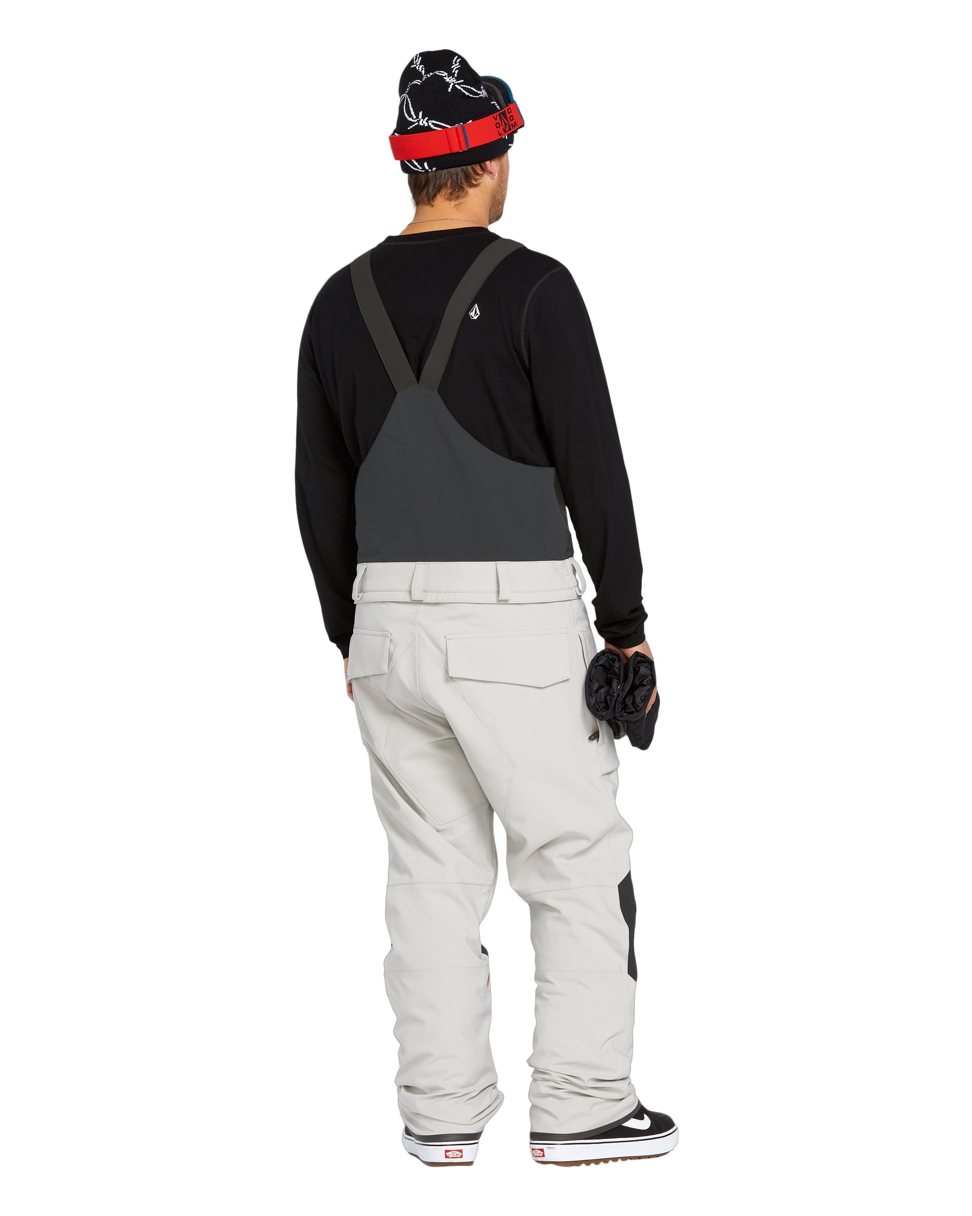 Volcom Men's Roan Shell Bib Overall - A black bib overall with a white logo on the left chest and a red zipper pull.
