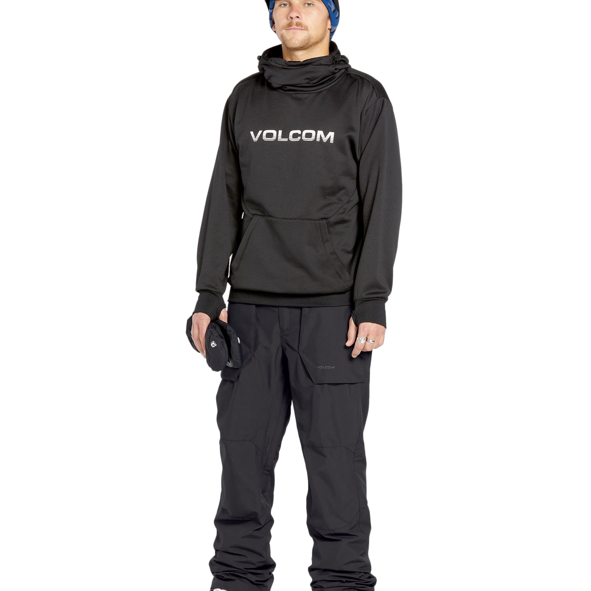 Volcom Men's Roan Shell Pant 2025 - A black snowboard pant with a zippered pocket on the thigh and adjustable Velcro straps at the waist.