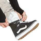 Volcom Men's Roan Shell Pant - A pair of khaki-colored snow pants with a white logo on the left leg.