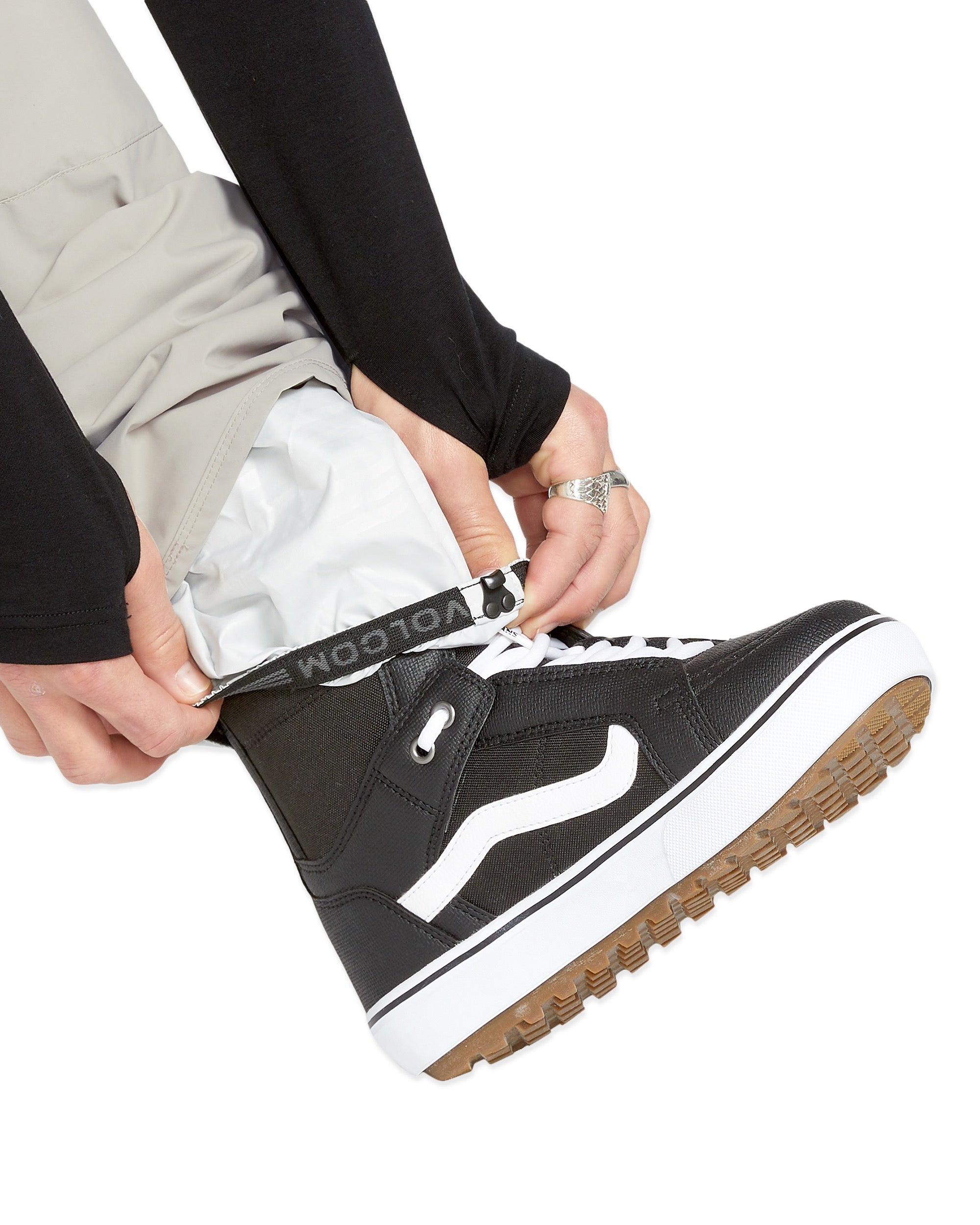 Volcom Men's Roan Shell Pant - A pair of khaki-colored snow pants with a white logo on the left leg.