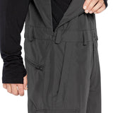 Volcom Men's V.Co Sparta Bib Overall - Black bib overall with black zipper and black Velcro straps on waistband.