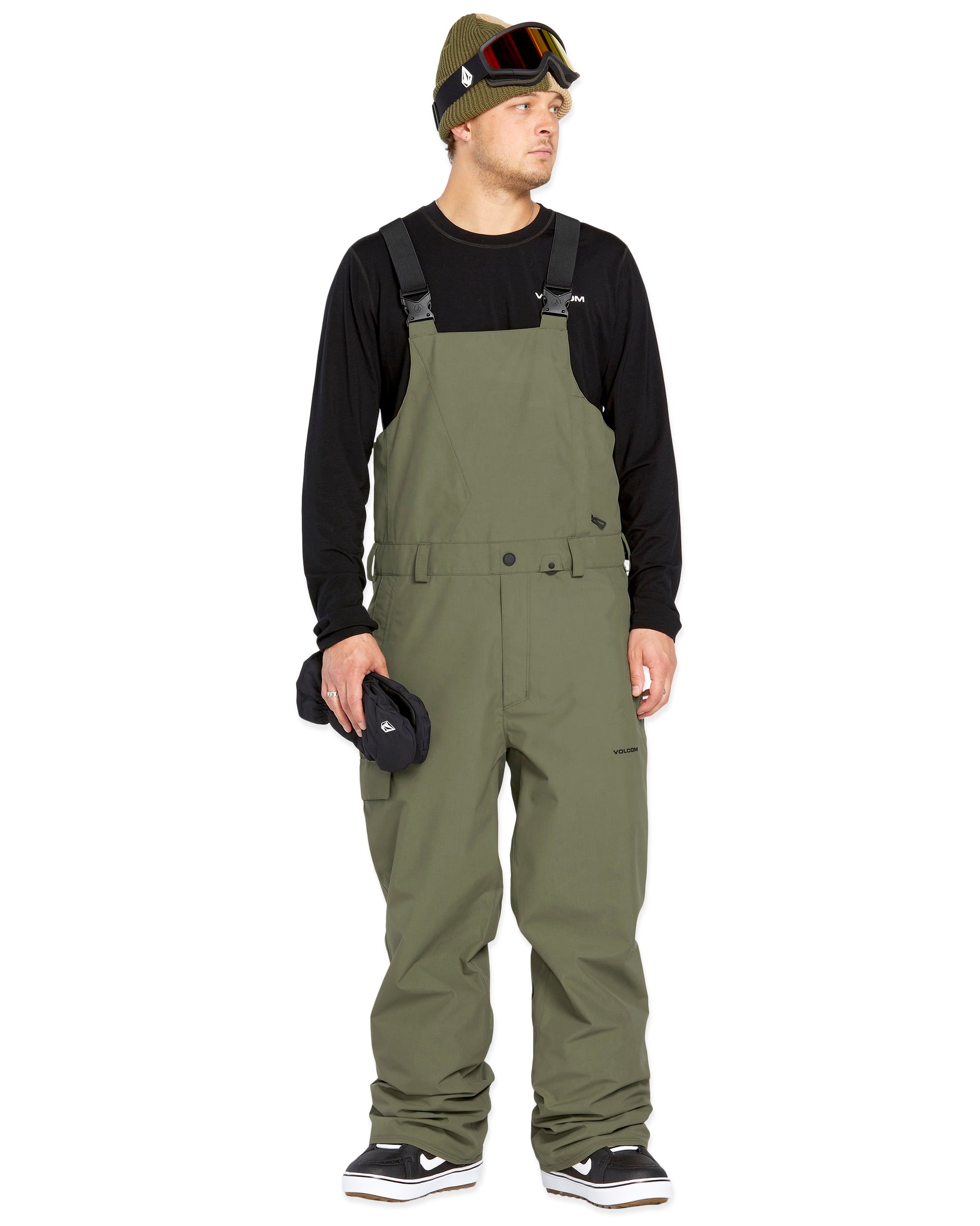 Volcom Men's V.Co Sparta Bib Overall - Olive green bib overalls with black straps and a small white logo on the left leg.