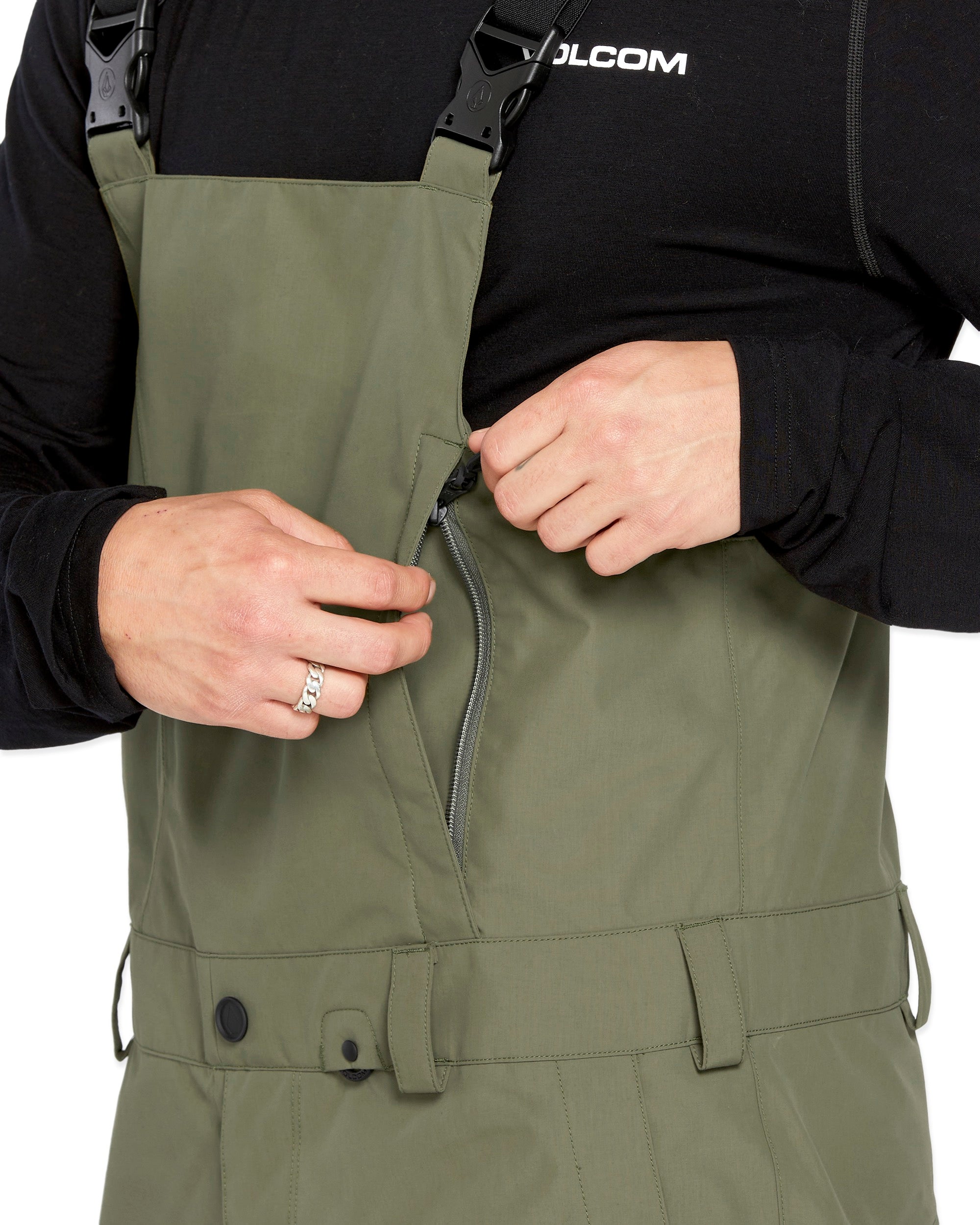 Volcom Men's V.Co Sparta Bib Overall - Olive green bib overalls with adjustable straps and black buckles.